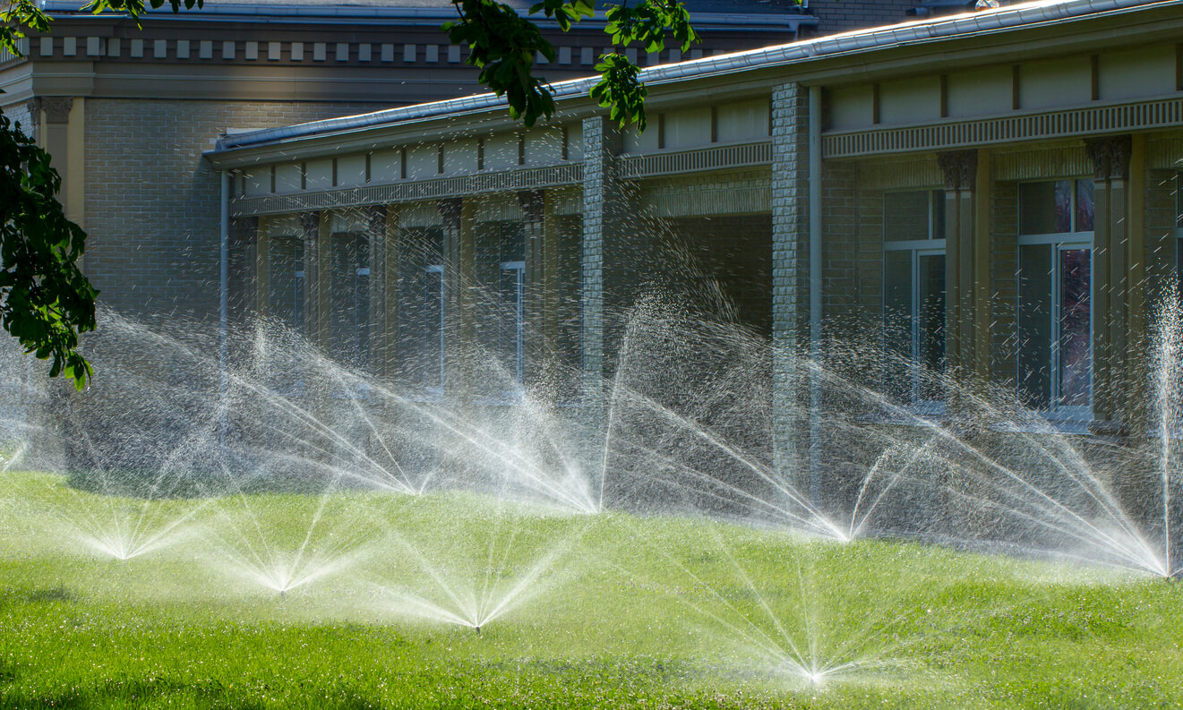 Picture of a lovely home with Hunter MP Rotator sprinklers watering the lawn.